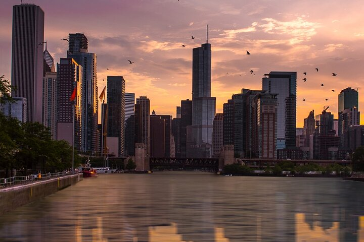 Experience the tranquil waters of Lake Michigan as the sun sets casting a warm glow over Chicago's iconic skyline creating unforgettable memories on this delightful sunset cruise.